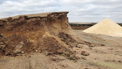 Piles of uncovered feedstuffs