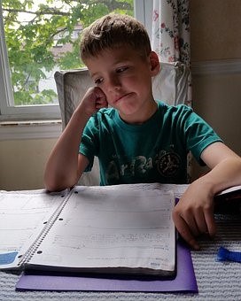 A young boy having difficulty with homework