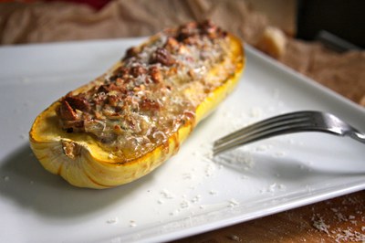 Roasted delicata squash stuffed with nuts and cheese.