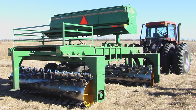Tractor pulling aerator rollers 