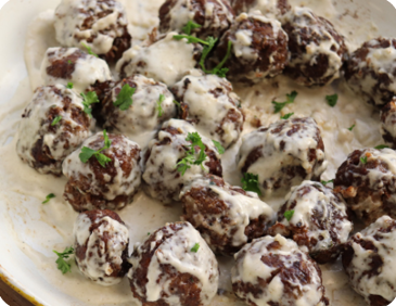 Meatballs covered in a creamy gravy
