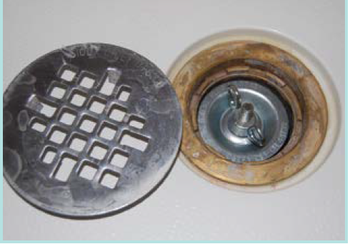 Figure 14. Plugging shower drain.