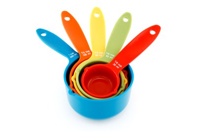photo of colorful measuring cups stacked together
