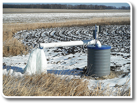 Figure 3. This drainage lift station uses a manufactured plastic sump casing with a metal cover containing a submersible pump. This photo was taken in mid-November when the temperature was below freezing.