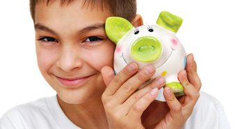 smiling child with piggy bank