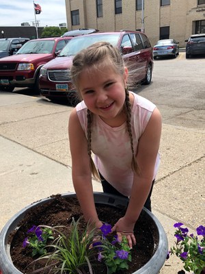 Girl planting flowers