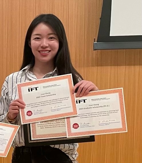 . Liuyi Chang, Ph.D. candidate holds her two awards