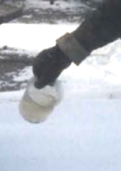 Figure 28.1 Anhydrous ammonia poured into a beaker using proper safety equipment on a very cold day.