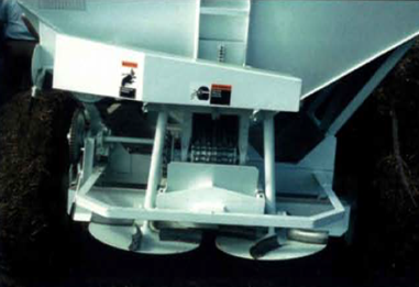 Figure 28.11 A Spinner-type dry fertilizer spreader. This method of application is still commonly used by farmers. Care should be taken when applying, considering that urea does not throw as far as MAP or potash due to its low relative density. If using a blended product of urea with something else, ‘splitting the middles’ would be wise to avoid both over application and under application strips. This means if the width of the throw is 50 feet, the driver should set the spreader to half rate, and drive 25 feet between passes. NDSU image