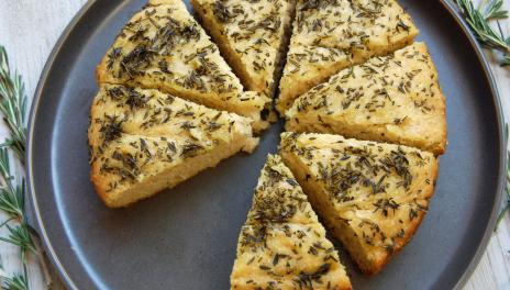 Rosemary Focaccia Bread, fully cooked and sliced on a pan