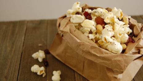 Trail Mix Popcorn, served in a paper bag