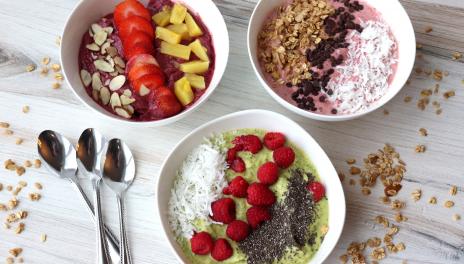 3 bowls of smoothies with toppings