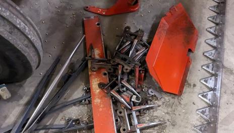 Metal pieces salvaged from a plot combine 