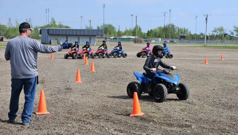 A child participates in a North Dakota OHV Youth Safety Course certification training program held during an NDSU Extension Farm Safety Camp. 