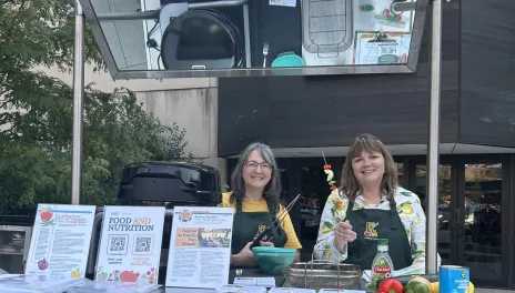 Julie Garden-Robinson, NDSU Extension food and nutrition specialist, and Beth Dahl, grant coordinator, share a cooking demo at the Red River Market.