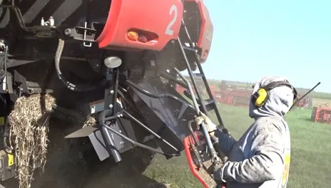 Someone blowing off dust from a combine.