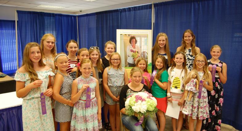 group of girls holding ribbons at state fair 4-H competition