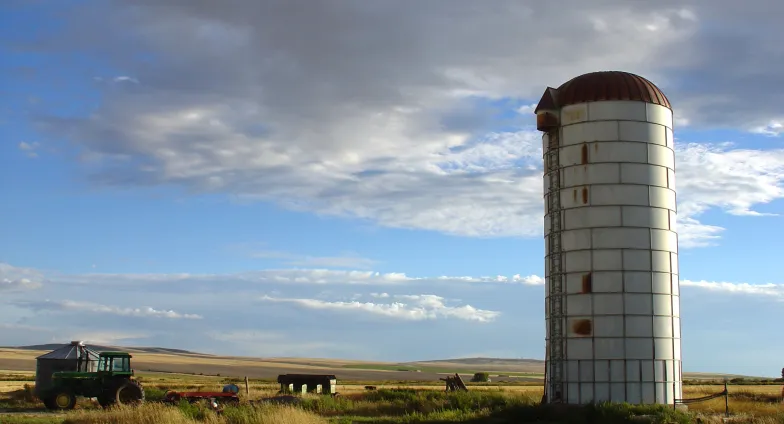 A vintage silo in a field on a sunny date