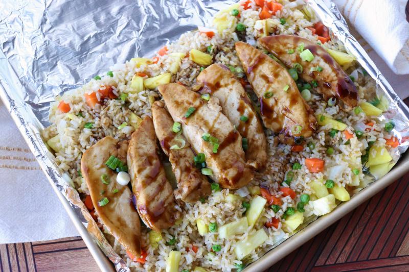 sheet pan with teriyaki chicken and pineapple fried rice
