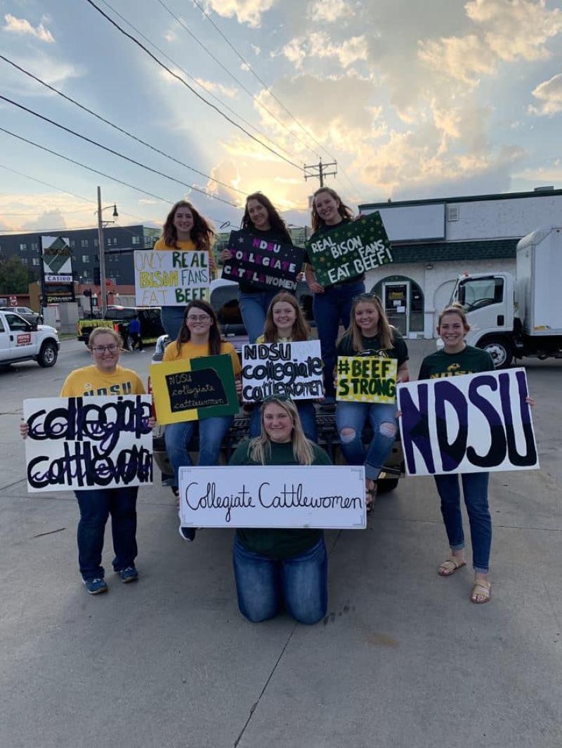 Collegiate Cattlewomen posing with NDSU signs