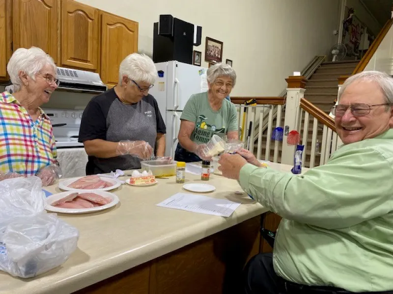 Senior citizens doing meal prep