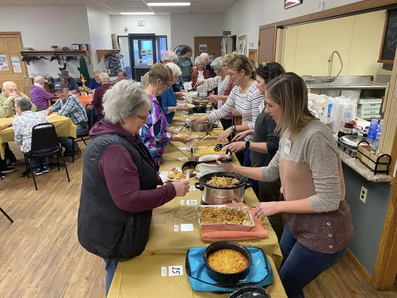 people in line at a lunch buffet
