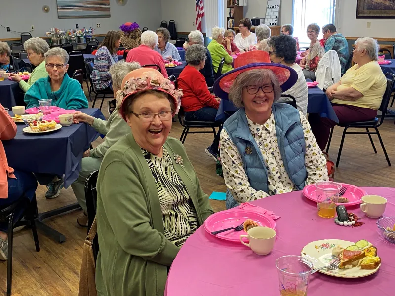 ladies posing at a table luncheon