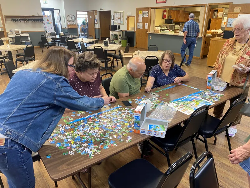 people doing puzzles