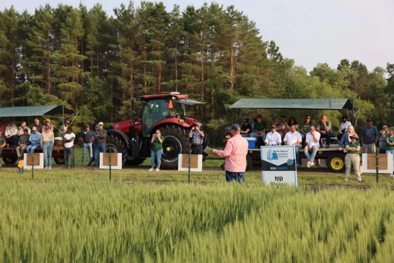 Man giving a wheat presentation to an audience on trailers
