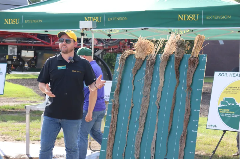 Man doing a demonstration on crops