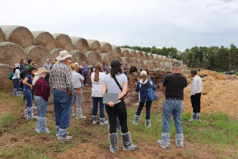 Field day participants view compost demonstration.