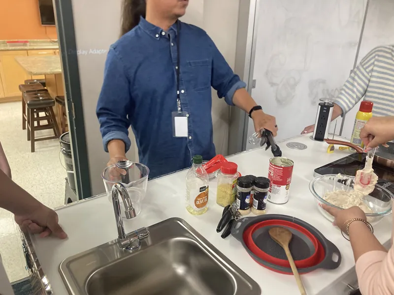 Arlan Littlewolf doing prepwork before cooking demonstration