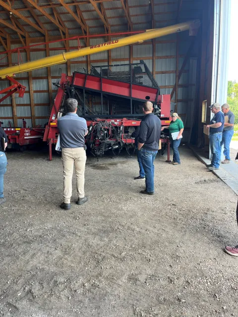 a woman demonstrates grain bin safety