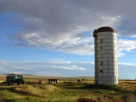 A vintage silo in a field on a sunny date