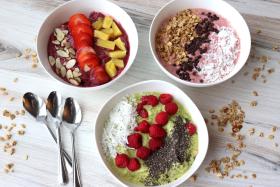3 bowls of smoothies with toppings
