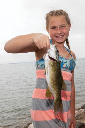 girl holding a fish 