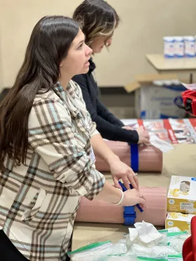 Participant practices tourniquet techniques. 