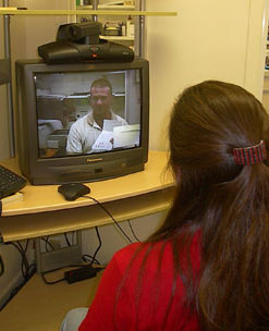 image of telepharmacist on tv monitor