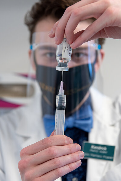 image of student filling syringe