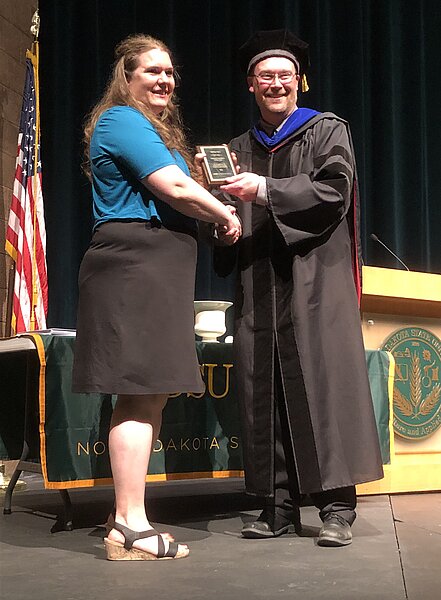 Photo of Dr. Andrea Agre, accepting Adjunct Preceptor of the Year Award