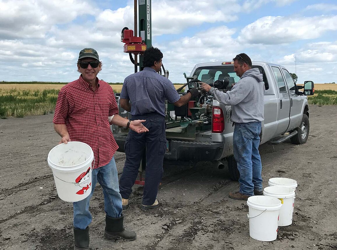 NDSU Extension specialist and agents use a pickup-mounted soil probe to test soil salinity