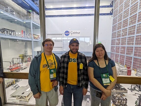 Three students at the PHYSCON conference