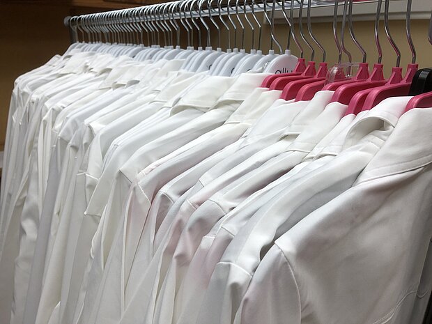 photo of NDSU white coats on hangers