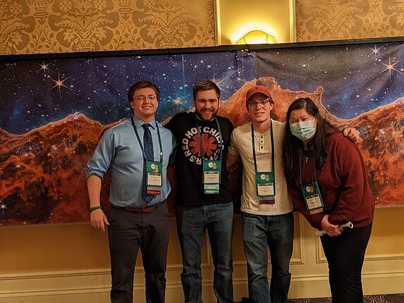 Four students at the PHYSCON conference