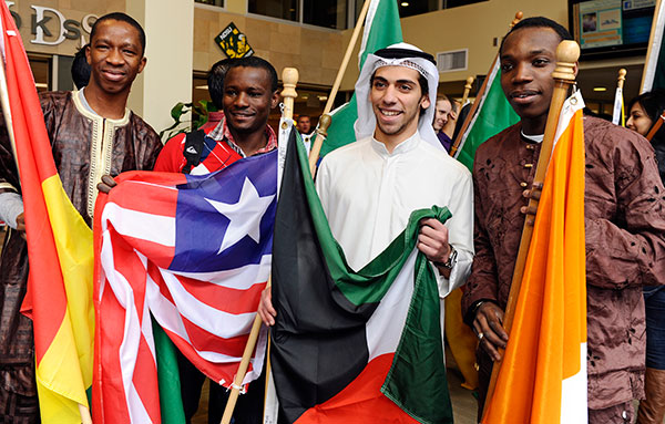 Students from around the world display their national flags