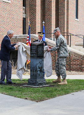 NDSU alumnus Sylvan Melroe, left, was named to the national ROTC Hall of Fame in 2016. Part of the celebration included unveiling a monument at NDSU to commemorate 100 years of ROTC. Also pictured are LTC Ted R. Preister, leader of the Bison Battalion, NDSU ROTC; and LTC Jason Benson (BS Engineering, ’96) of the Minnesota National Guard.