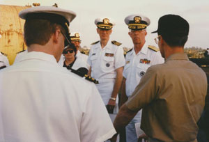 Rear Admiral (Ret.) Fred Paavola, an NDSU alumnus, (pictured right) by the USS Kitty Hawk in 1997 served in the U.S. Army Medical Service Corps and the U.S. Public Health Service. Involved in ROTC while attending NDSU for his pharmacy degree, Paavola was named to the national ROTC Hall of Fame in 2016.