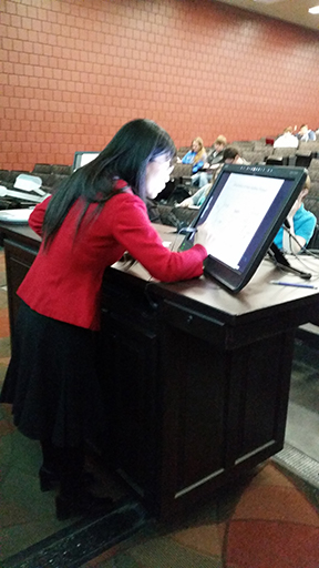 Faculty member using technology