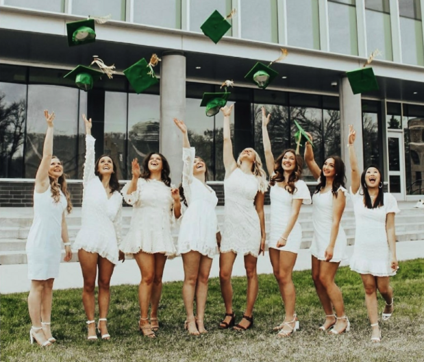 Winter Commencement Students Throwing Caps Into Air
