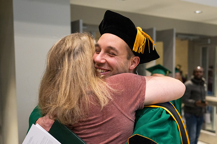 Student hugging after commencement